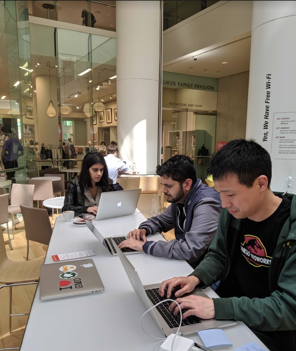 Software engineers and intern coding at the Museum of Fine Arts